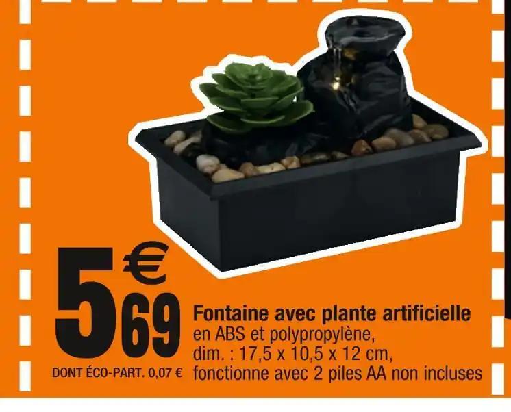 Fontaine avec plante artificielle